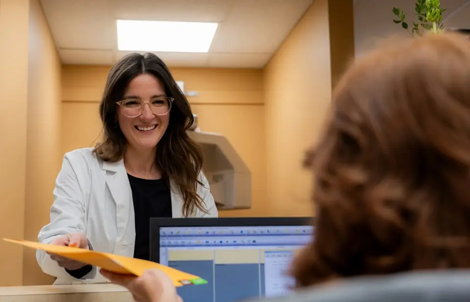 Front desk staff talking about a patient file